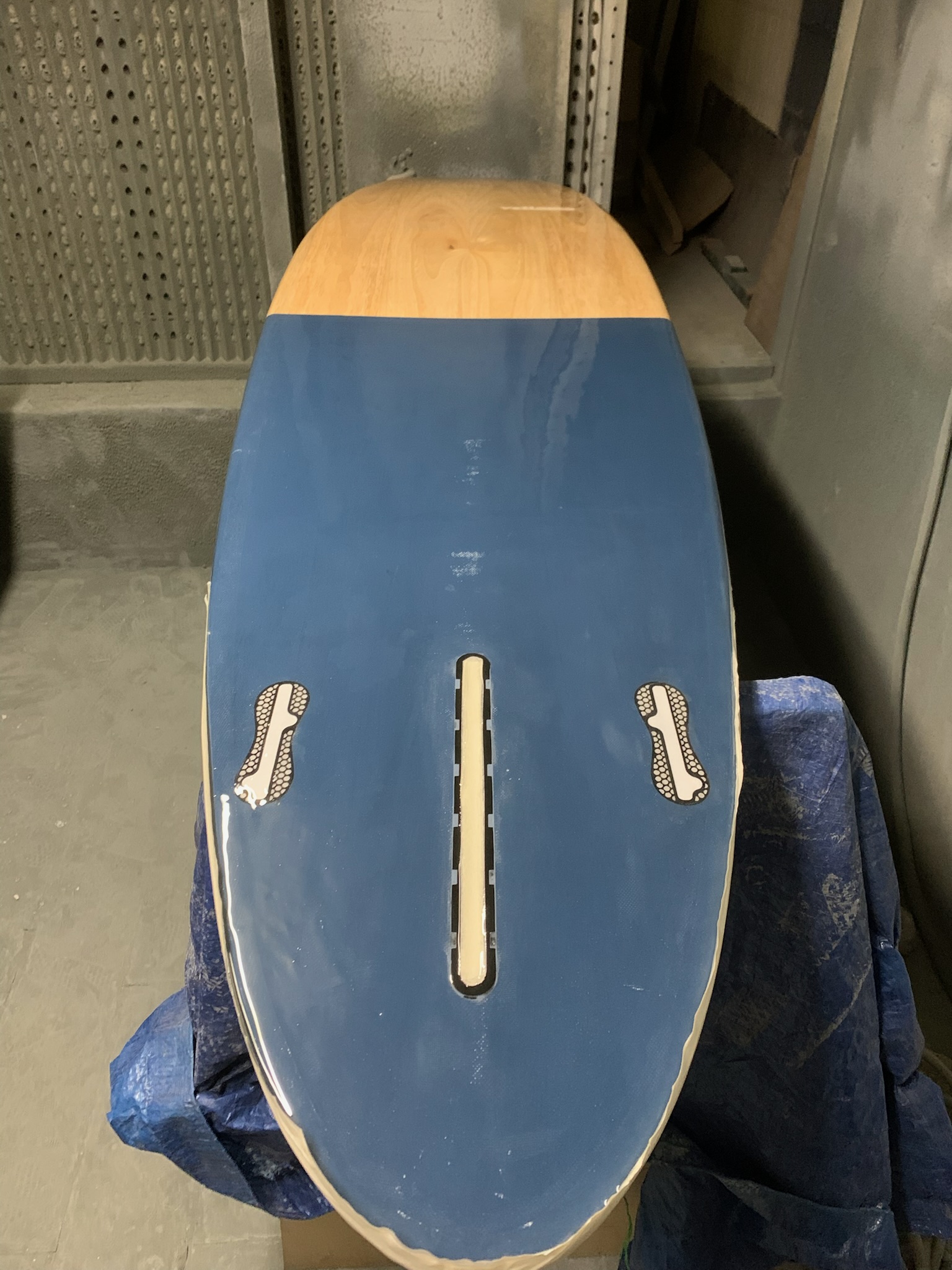 The underside of a finished board showing its fin boxes